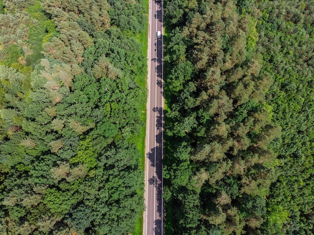 Aerial view of straight highway sunny day car travel concept