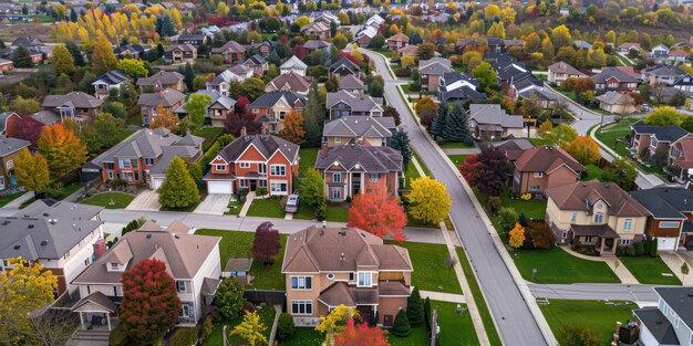 An aerial view of a suburban neighborhood with rows of houses