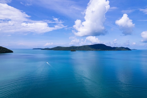 Aerial view summer sea in sunny day with longtail fishing boatBeautiful clouds blue sky background