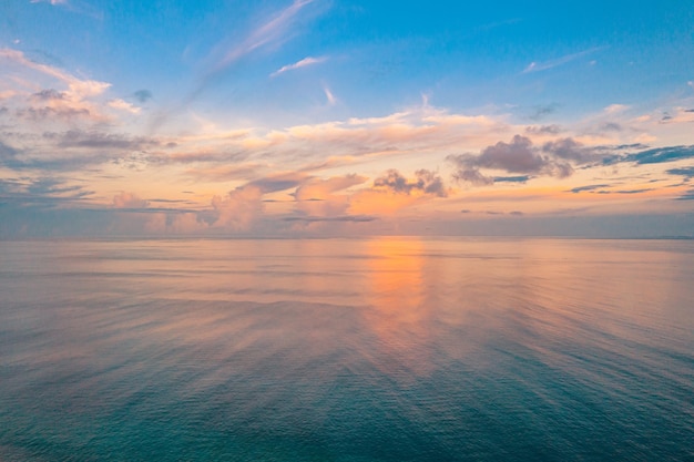 Aerial view of a sunset sky dream sea horizon reflection Aerial dramatic gold sunset sky clouds