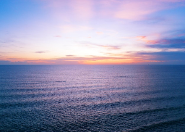 Aerial view sunset sky Nature beautiful Light Sunset or sunrise over sea Colorful dramatic majestic scenery Sky with Amazing clouds and waves in sunset sky purple light cloud background