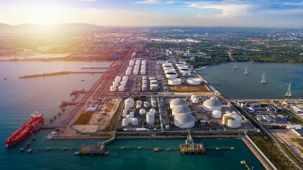 Aerial view tanker and oil storage tank petrochemical oil shipping terminal.