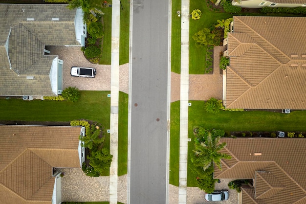 Aerial view of tightly located family houses in Florida closed suburban area Real estate development in american suburbs