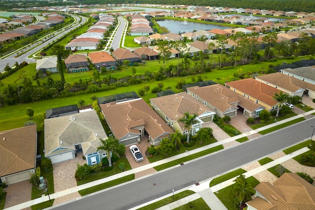 Aerial view of tightly packed homes in Florida closed living clubs Family houses as example of real estate development in american suburbs