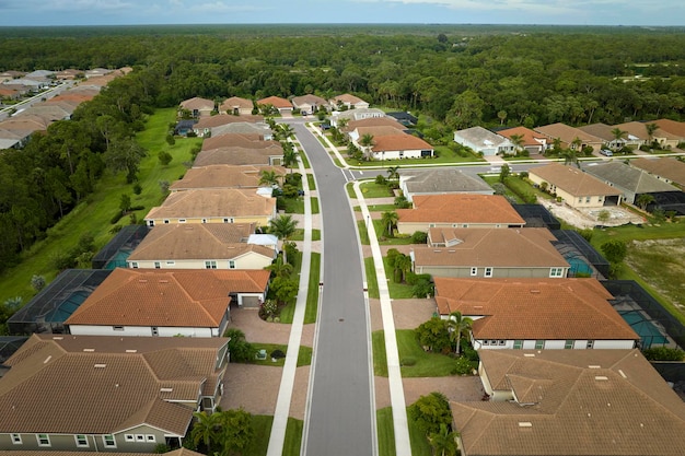 Aerial view of tightly packed homes in Florida closed living clubs Family houses as example of real estate development in american suburbs