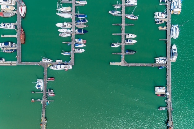 Aerial View Top down Drone shot of Yacht and sailboat parking  in marina