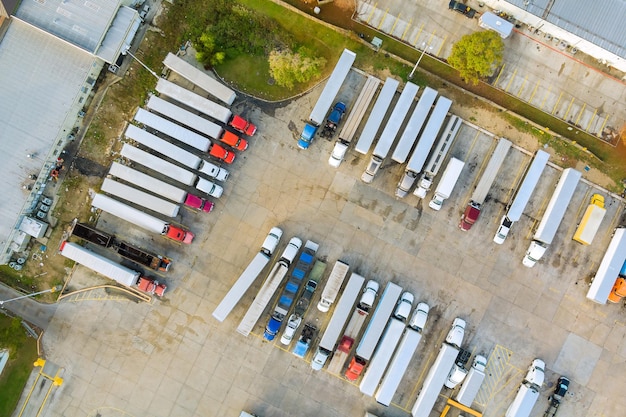 Aerial view of transportation station with truck stop near interstate highway on parking cargo