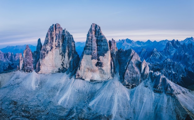 Aerial view of Tre Cime di Lavaredo at dusk light Sesto Dolomites Italy