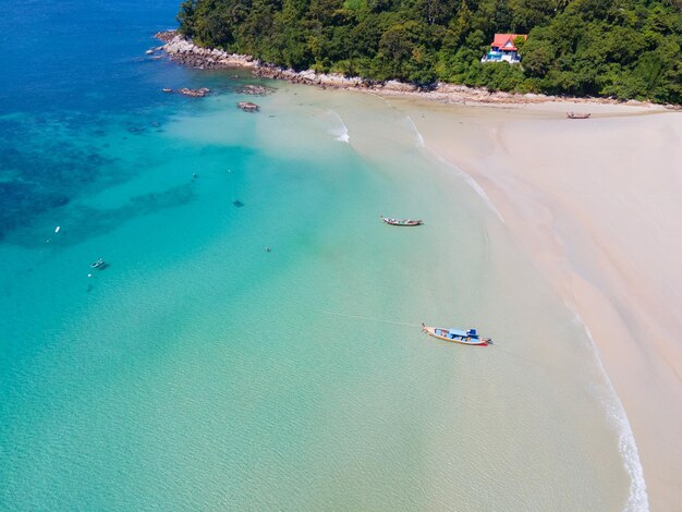 Aerial view tropical beach and sea Top down view of drone Andaman sea Phuket Thailand