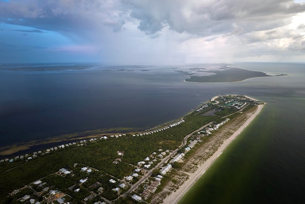 Aerial view of tropical storm over expensive residential houses in island small town Boca Grande on Gasparilla Island in southwest Florida