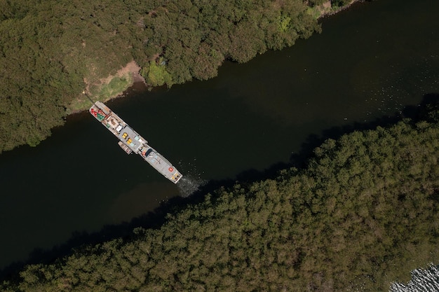 Aerial view of a tugboat moored on the bank of the Tiete river