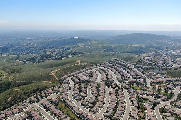 Aerial view of upper middle class neighborhood with big villas around Double Peak Park in San Marcos