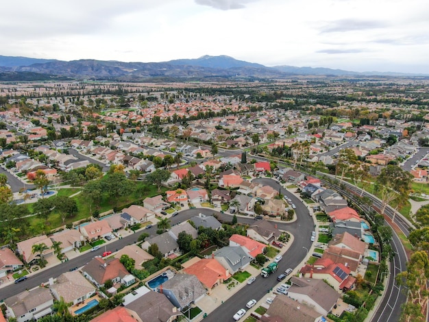 Aerial view of urban sprawl Suburban packed homes neighborhood with road Subdivision