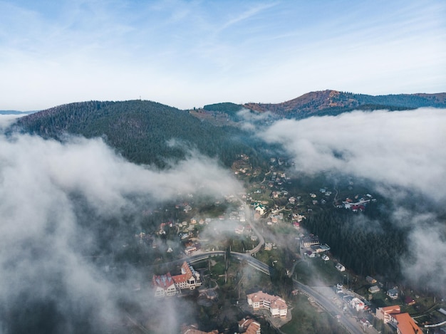 Aerial view of village in mountains clouds over it. travel concept