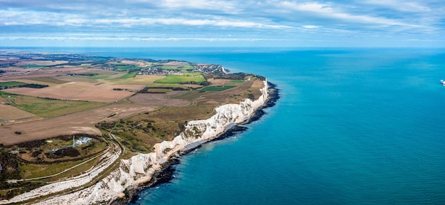 Aerial view of the White Cliffs of Dover. Close up view of the cliffs from the sea side. England, East Sussex. Between France and UK