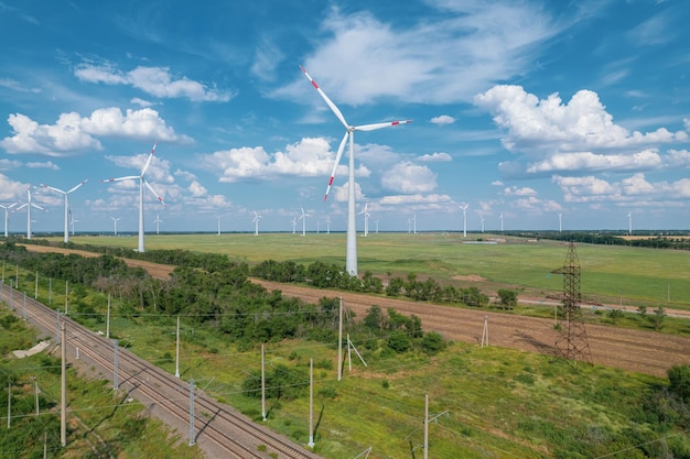 Aerial view of Wind power turbine is a popular sustainable renewable energy source on beautiful cloudy sky Wind power turbines generating clean renewable energy for sustainable development