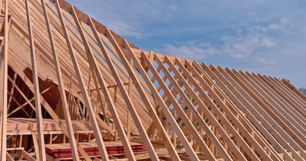 Aerial view of wood beams framework under construction on new wooden building