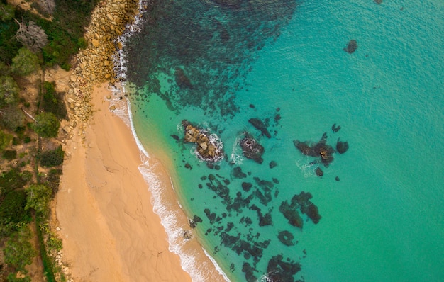 Aerial views of the beach and the waves in the Mediterranean. 