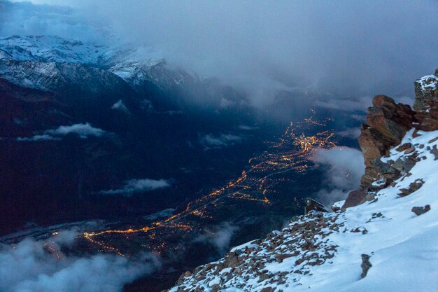 Aeriel view of the night city lights in the mountain valley