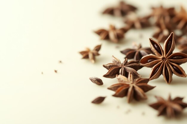 Photo aesthetic arrangement of star anise on a light background showcasing its unique shape and texture