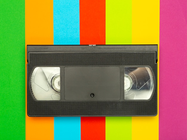 Aesthetics of the 80s and 90s. Videocassette (VHS) on a color background. Video, minimal, retro concept