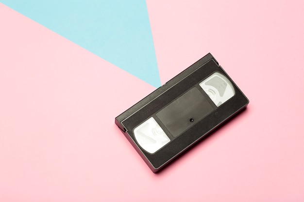 Aesthetics of the 80s and 90s. Videocassette (VHS) on a color background. Video, minimal, retro concept