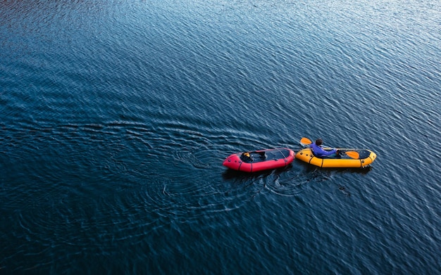 Afloat in Autumn Tourists Enjoying a Mountain Lake Sunset