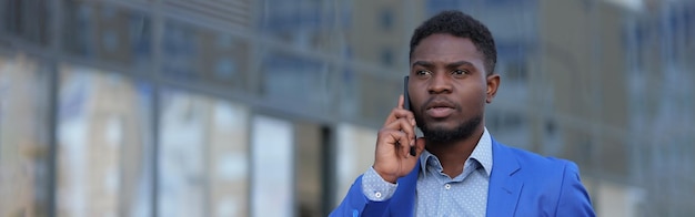 African american bearded man calls to colleague on phone