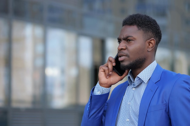 African american bearded man calls to colleague on phone