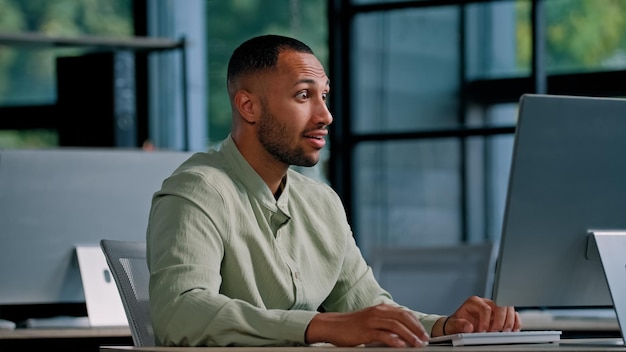 African american businessman employer entrepreneur manager ceo typing keyboard computer in office