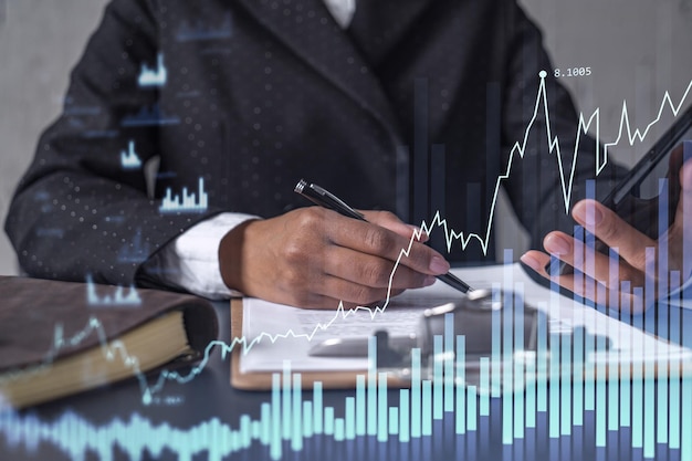 African American businesswoman in formal wear is signing the contract to invest money in stock market Internet trading and wealth management Checking the details of transaction at smart phone Forex