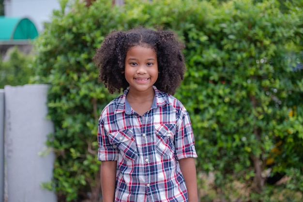 African American kid girl standing and smile confident