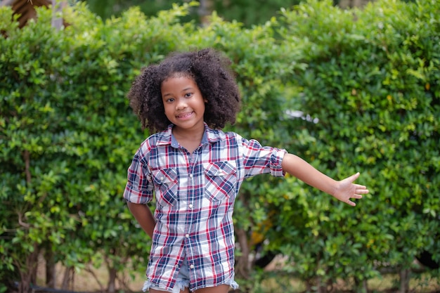 African American kid girl standing and smile confident