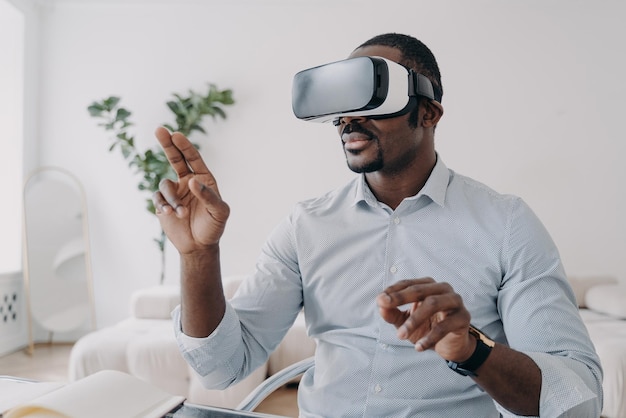 African american man developer in VR glasses use virtual reality modeling software Future high tech