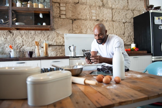 African American man photographing what he has cooked