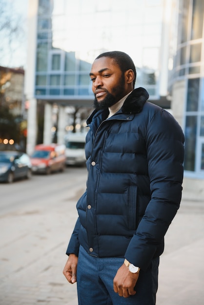 African American man in stylish new clothes on the street