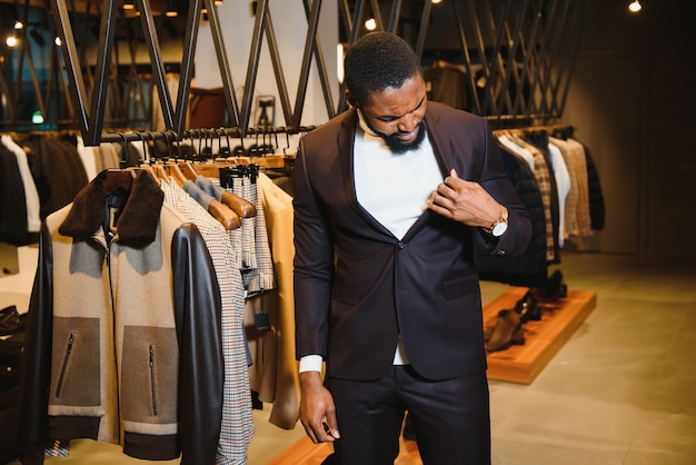 African American man in stylish new clothes on the street