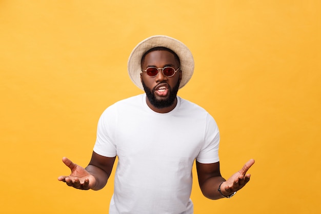 African american man wearing white t-shirt shouting and screaming loud to side with hand on mouth.