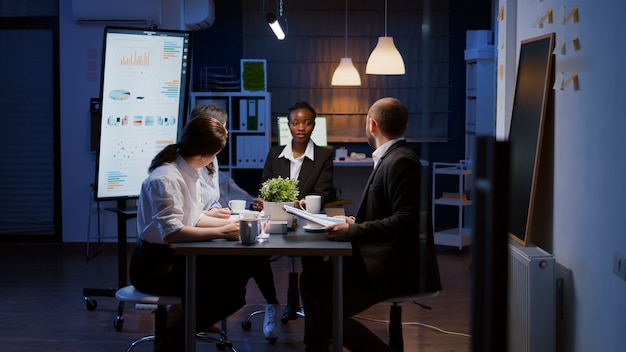 African american manager woman discussing financial graphs presentation