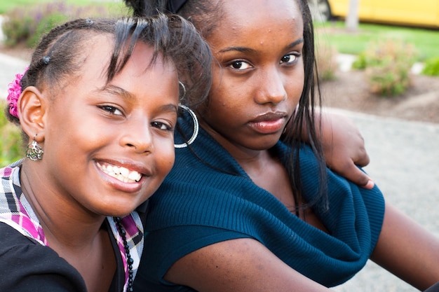 African American sisters in the park.