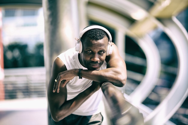 African american sportsman get relax after jogging in city