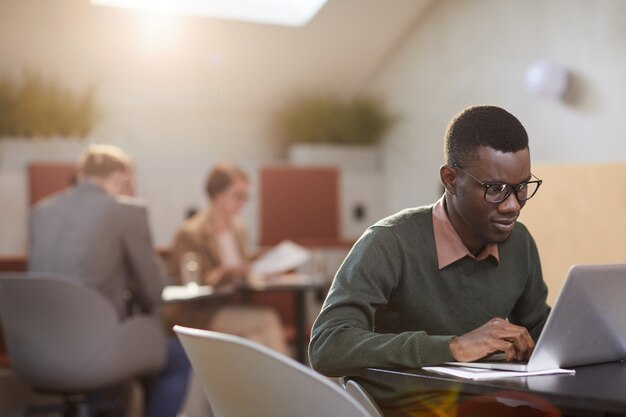 African-American Student Working in Cafe