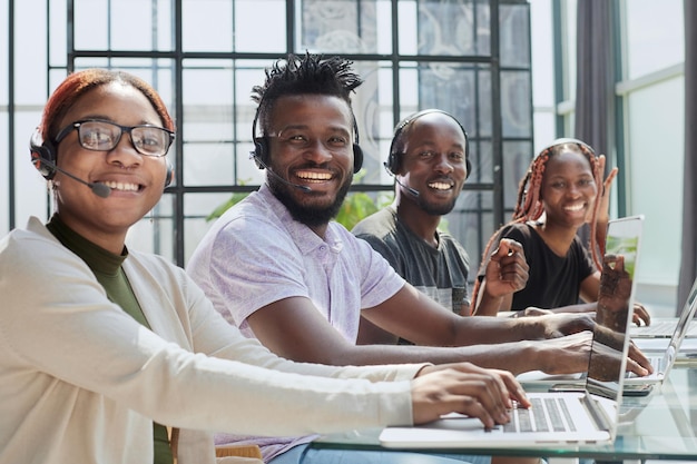 African american team working at call center office to help people with telemarketing assistance