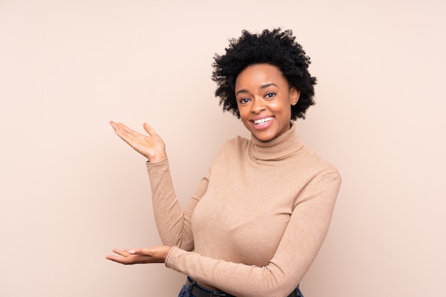 African American woman over beige wall