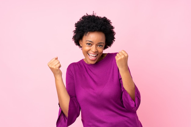 African American woman over pink wall