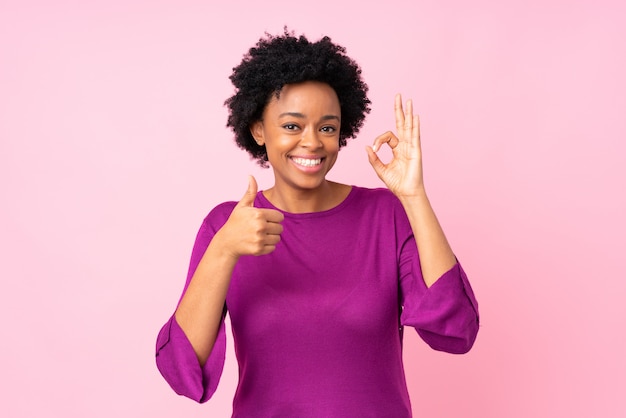 African American woman over pink wall