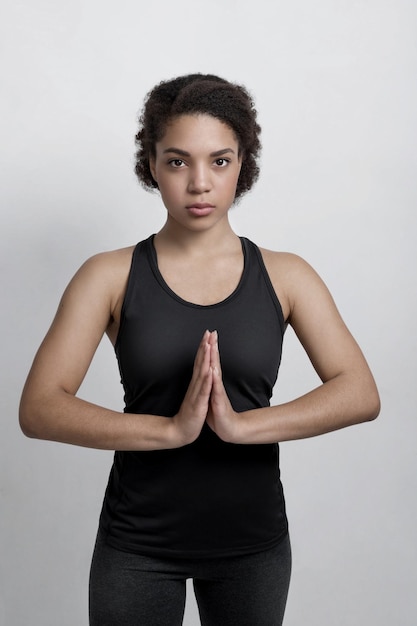 African American woman practicing yoga at home Pose namaste