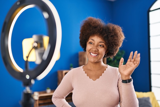 African american woman smiling confident having video call at home