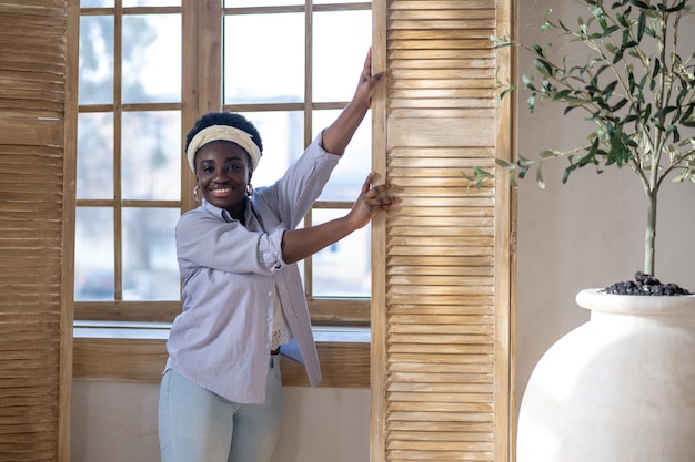 African american woman standing near the window