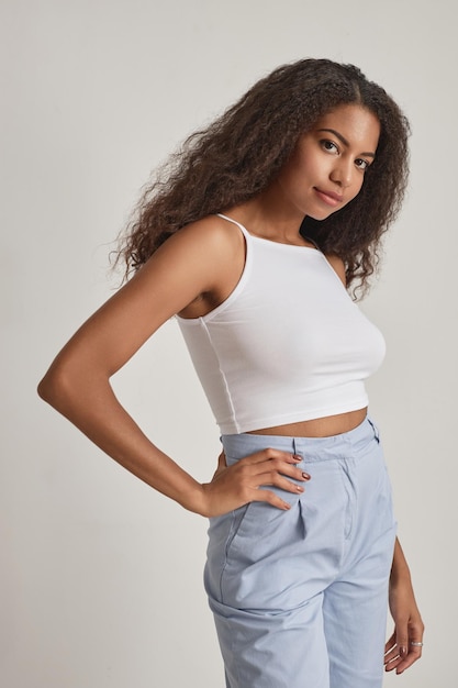 African american woman with curly hair smiling at camera